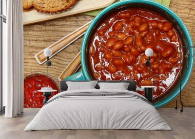 Bowl of Baked Beans and Ketchup at Table Wall mural