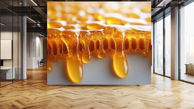 Close-up of dripping honey showcasing its texture and richness. Wall mural