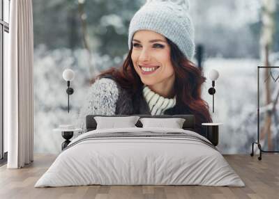 beautiful smiling young woman in wintertime outdoor. Winter concept Wall mural