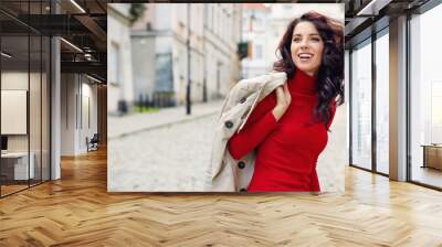 Beautiful woman in autumn style in town. Fashionable concept Wall mural