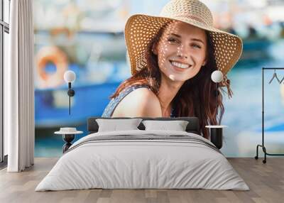 portrait of a beautiful woman in a straw hat. laughing girl. summer time Wall mural