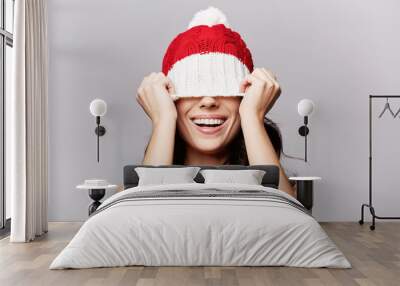 smiling beautiful girl in christmas cap Wall mural