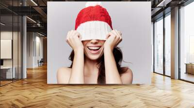 smiling beautiful girl in christmas cap Wall mural