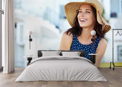 Smiling beautiful young woman in summer hat Wall mural