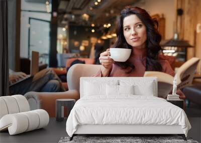 woman drinking coffee in a cafe Wall mural