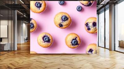 Blueberry Muffins on Pink Background: Showcases delicious blueberry muffins on a soft pink background, emphasizing their homemade appeal. Wall mural