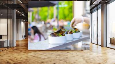 A portion of cooked mussels on a plate. Outdoor food on the terrace. Wall mural