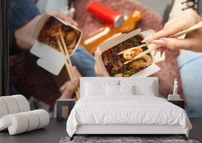 Closeup macro view of a delicious Wok Noodles with greenery in takeout paper box with chop sticks Wall mural