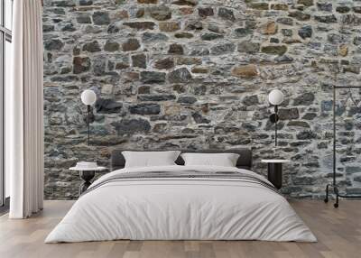 Texture of a stone wall. Old castle stone wall background. Wall made of wild stone. Natural background Wall mural