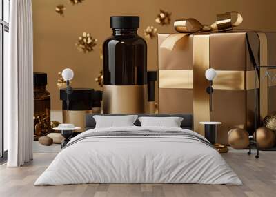 A close-up of a gift box tied with a gold ribbon and a set of brown glass bottles with gold labels. Wall mural