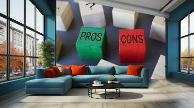 Selective focus image of wooden blocks with question mark, text PROS and CONS. Wall mural