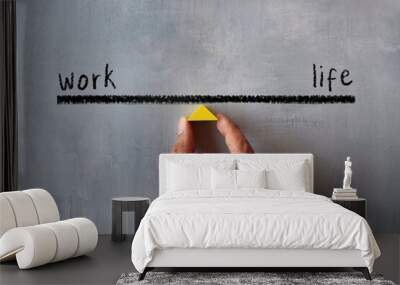 Top view image of hand holding wooden triangle. Work life balance concept. Wall mural