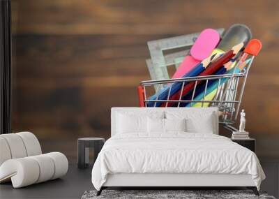 Back to school: School supplies in shopping cart Wall mural