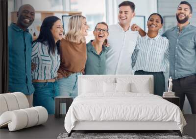 Teamwork, friends and funny with business people laughing together in their office at work. Collaboration, happy and success with a man and woman employee group joking while working as a team Wall mural