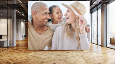 Happy, child and interracial parents at the beach for a holiday in summer in Indonesia together. Smile, playful and mother and father with care and affection for girl at the ocean on a vacation Wall mural