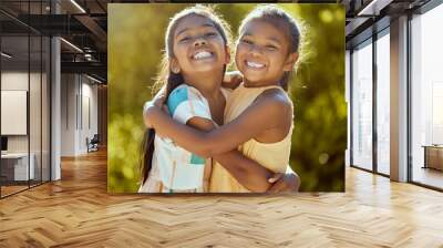 Happy children, sisters and girl friends hug for love, care and bond in sun park, summer garden and backyard in outdoor Colombia. Big smile, funny and playful portrait of young kids hugging together Wall mural