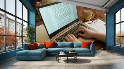 Modern writer writing a novel on a laptop Wall mural