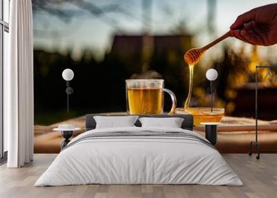 hot tea and honey in teacup outdoor Wall mural