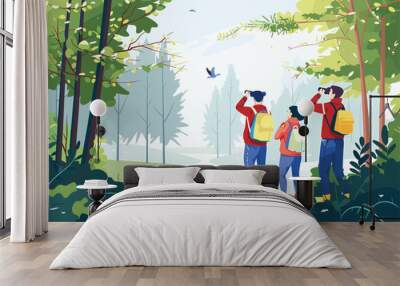 A group of people are leisurely observing birds in a natural landscape surrounded by trees, grass, and greenery. They are enjoying the serene event in the woods Wall mural