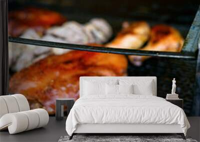 Two grilled chicken legs on the grill Wall mural