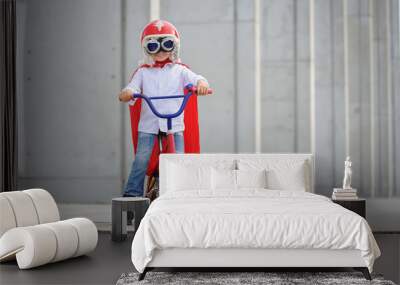 A funny, little superhero. Concept boy imagination. Happy childhood. Wall mural