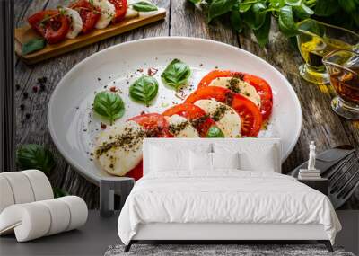 Caprese salad on wooden table
 Wall mural