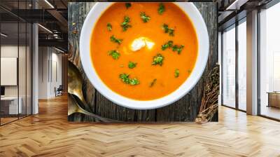 Cream tomato soup with fresh parsley on wooden table
 Wall mural