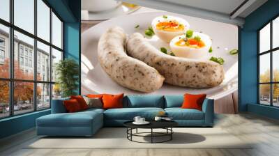 Easter breakfast - eggs, boiled white sausages and vegetables Wall mural