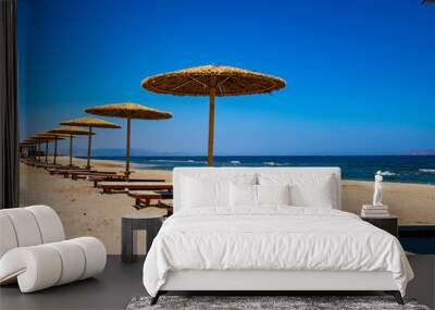 Empty deckchairs and parasols on empty beach
 Wall mural