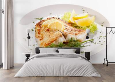 Fish dish - fried fish fillet and vegetables Wall mural