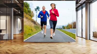 Healthy lifestyle - woman and man running Wall mural