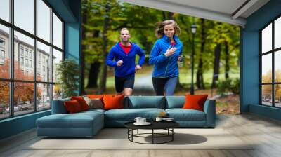 healthy lifestyle - woman and man running Wall mural