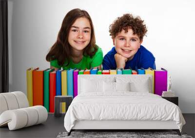 Kids behind pile of books isolated on white background
 Wall mural