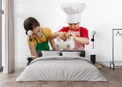 Kids mixing dough isolated on white background Wall mural