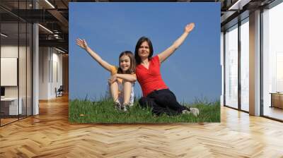 Mother with daughter relaxing Wall mural