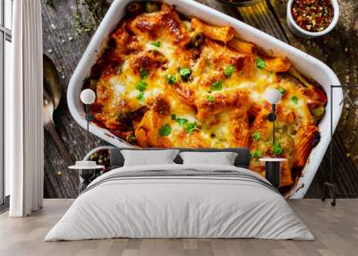 Pasta casserole with minced meat, mozzarella cheese and vegetables on wooden table
 Wall mural