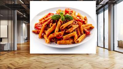 Penne with meat, tomato sauce and vegetables on white background Wall mural