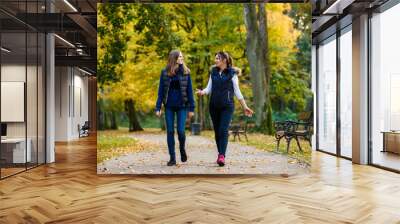 People walking in city park Wall mural