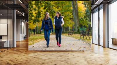 People walking in city park Wall mural