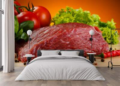 Raw beef on cutting board and vegetables Wall mural