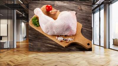 raw chicken leg on cutting board on cutting background Wall mural