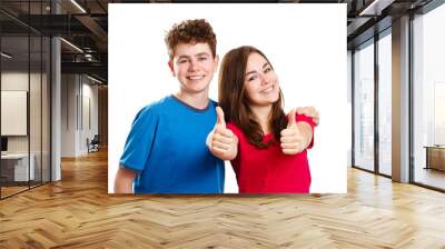 Teenage girl and boy showing OK sign isolated Wall mural