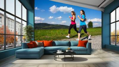 Young women running Wall mural