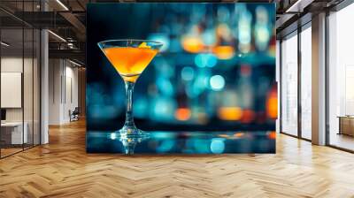 Cocktail in a martini glass on a bar counter. Wall mural