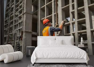 construction worker on construction site. workers who are casting concrete in multi-storey buildings Wall mural