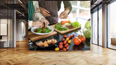 Two chefs help fry shrimp in the kitchen. Wall mural