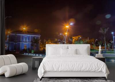 night view of Intendencia place with children playing and people. Wall mural