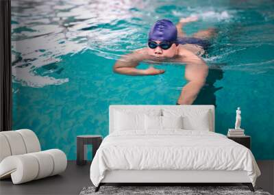 Asian fat male swimmer swimming in pool Wall mural