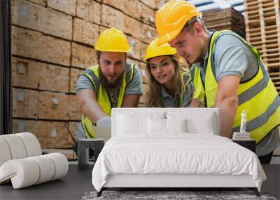 Wood warehouse workers working with with laptop in wooden distribution factory Wall mural