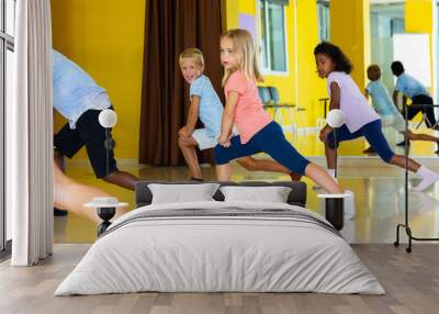 Active young children posing at dance class Wall mural